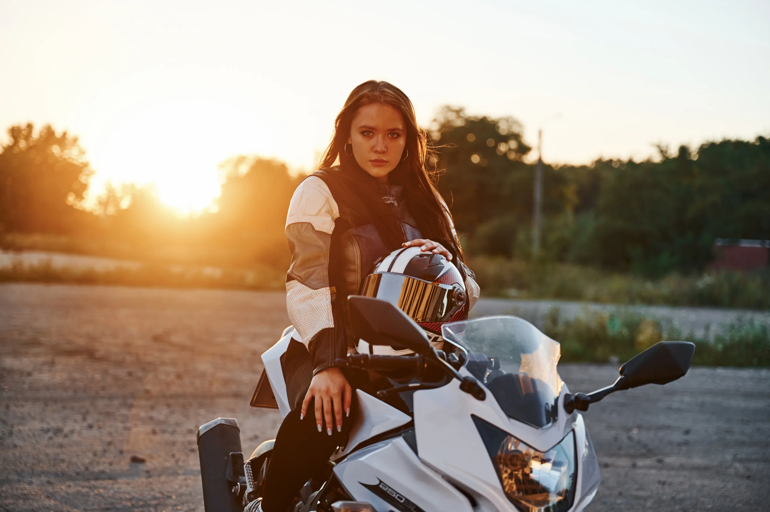 beautiful-woman-is-with-motorcycle-outdoors-2025-03-18-20-51-50-utc